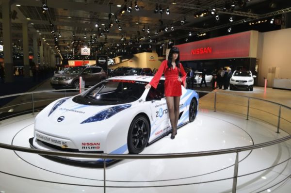 Models in front of car at Auto show