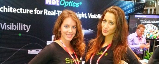 trade show booth models working at a convention