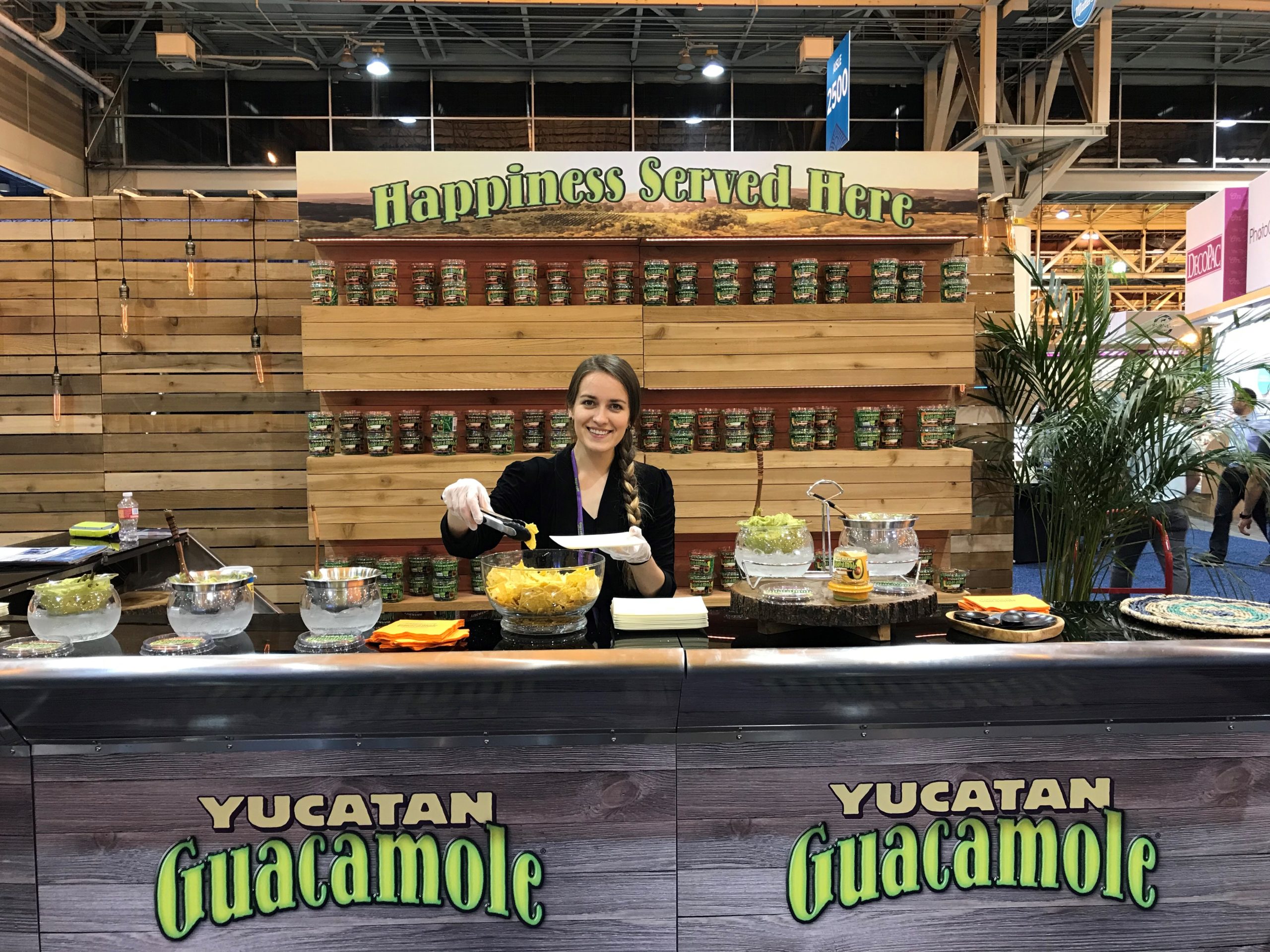 Booth hostess preparing samples at IDDBA trade show