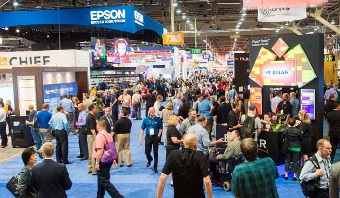 Exhibitors on the trade show floor at InfoComm